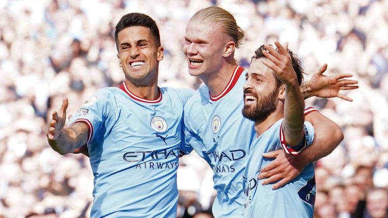 Erling Haaland celebrates with Bernardo Silva and Joao Cancelo after scoring Man City&#39;s third goal