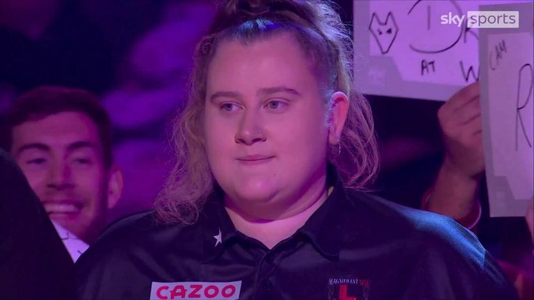 Beau Greaves makes her entrance to the stage ahead of her debut at Alexandra Palace