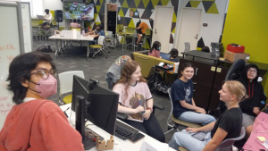 students gathered around a computer