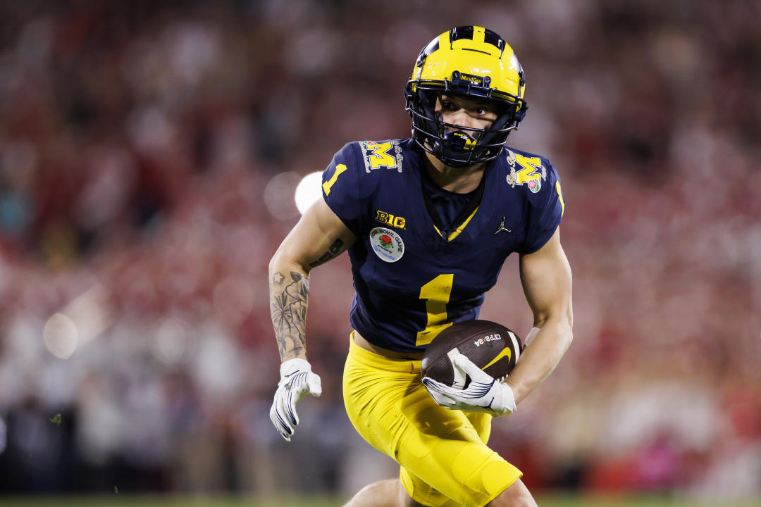 PASADENA, CALIFORNIA - JANUARY 01: Wide receiver Roman Wilson #1 of the Michigan Wolverines runs the ball after a catch during the CFP Semifinal Rose Bowl Game against the Alabama Crimson Tide at Rose Bowl Stadium on January 1, 2024 in Pasadena, California. (Photo by Ryan Kang/Getty Images)