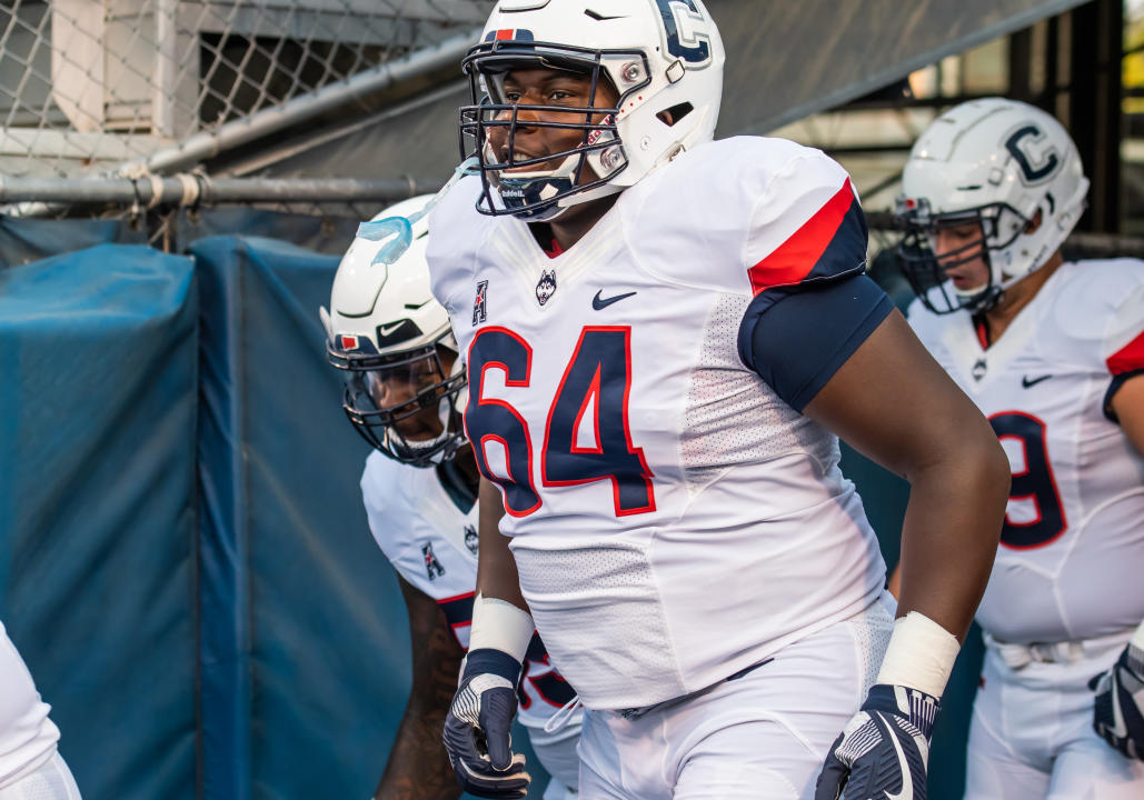 BOISE, ID - SEPTEMBER 08:Connecticut Huskies offensive lineman Christian Haynes (64) enters the field with teammates before the game between the Connecticut Huskies vs the Boise State Broncos on Saturday, September 8, 2018, at Albertsons Stadium in Boise, Idaho. (Photo by Douglas Stringer/Icon Sportswire via Getty Images)