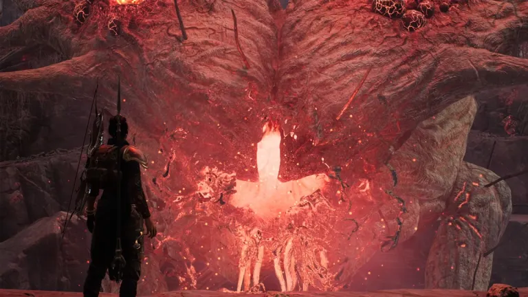 A character stares directly at a giant tentacle-horned beast glowing red in Remnant 2.